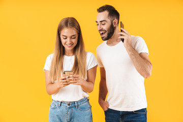 Poster - Image of happy man smiling while looking at cellphone of his girlfriend