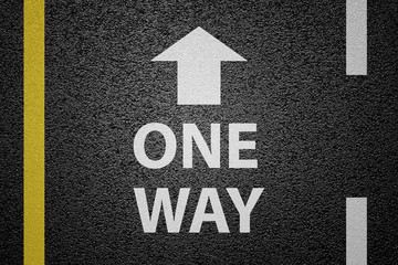 One way sign on asphalt ground