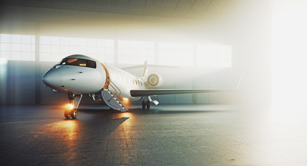 Business private jet airplane parked at maintenance hangar and ready for take off. Luxury tourism and business travel transportation concept. 3d rendering