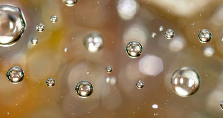 Wall Mural - Bubbles of air on the surface of water as an abstract background