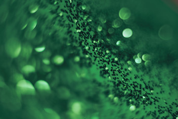 Poster - Beautiful abstact  light bokeh on a green background.