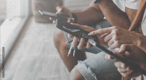 Fotomural Group of friends having fun together with smartphones - Closeup of hands social networking with mobile cellphones