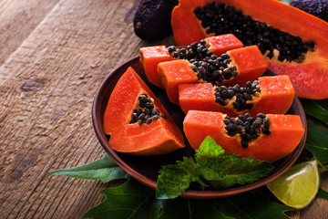 Sticker - sweet papaya on the dish with green papaya leaf