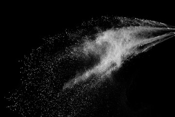 Wall Mural - freeze motion of white color powder exploding on dark background.