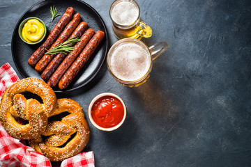 Wall Mural - Oktoberfest food - sausage, beer and bretzel.