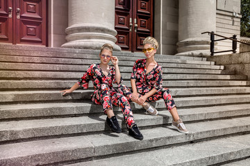 Wall Mural - Mother and daughter having fun in same outfits. Fashionable family - Image