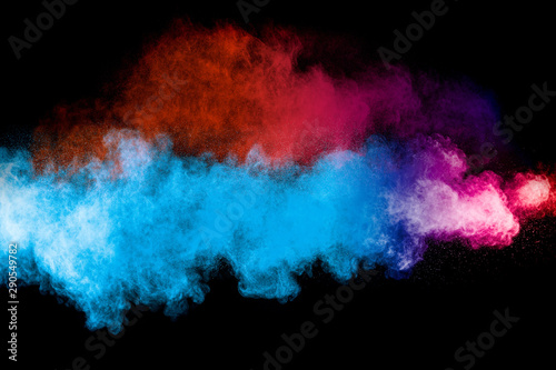 Launched multicolored powder on black background.Color powder explosion.Color...