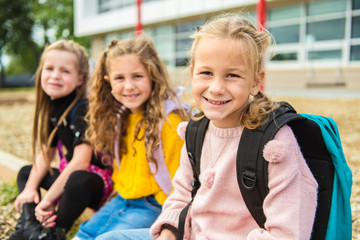 Wall Mural - group of kids on the school background having fun