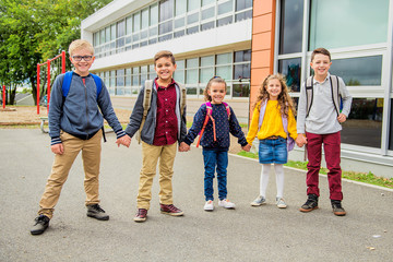 Wall Mural - group of kids on the school background having fun