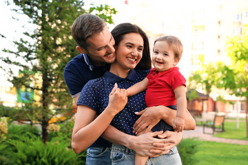 Canvas Print - Happy family with adorable little baby outdoors