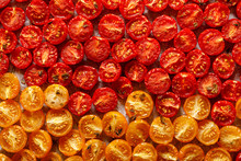 Dried Tomatoes, Dried Red And Yellow Cherry Tomatoes, Close Up, Top View. Sun Dried Tomato Background.