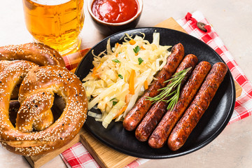 Wall Mural - Sausage, sauerkraut, bretzels and beer.