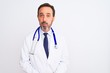 © Krakenimages.com - Middle age doctor man wearing coat and stethoscope standing over isolated white background puffing cheeks with funny face. Mouth inflated with air, crazy expression.
