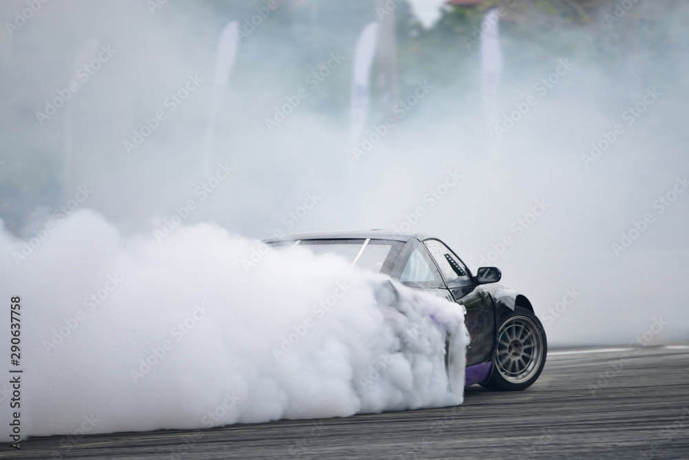 Motion Blur side view drift car. Drift car with  smoke from burning tires. - obrazy, fototapety, plakaty 