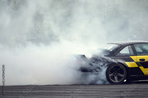 Cuadros en Lienzo Motion blur close up drift car with smoke from burning tires
