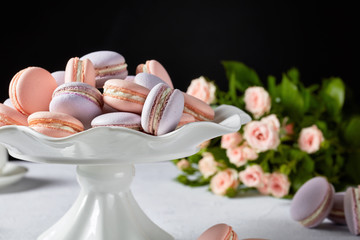 Wall Mural - macarons on a white stand, top view