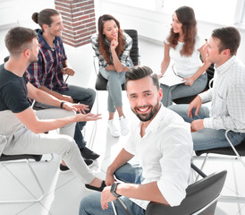 Manager and his team sitting in the office