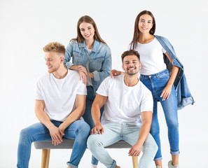 Wall Mural - Group of young people in stylish casual clothes on white background