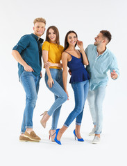 Wall Mural - Group of young people in stylish casual clothes on white background