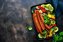 Grilled Bavarian Sausage With Vegetables. Top View With Copy Space.