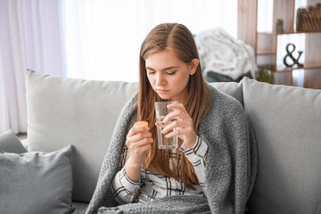 Sticker - Sick woman taking medicine at home