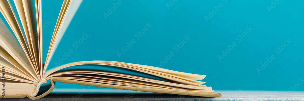 Open book, hardback books on wooden table. Back to school. Copy space - obrazy, fototapety, plakaty 