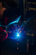 © Андрей Глущенко - Welder in the mask makes the metal. Close up. Sparks from welding.
