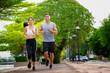 © bunyarit - Couples who take care of their health by exercising happily in the city. Health care concept