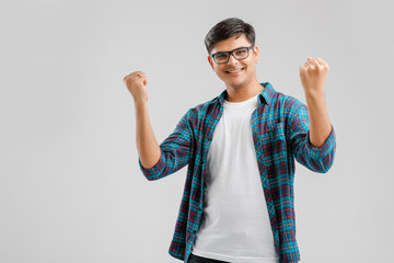 Sticker - Happy young Indian man over white background