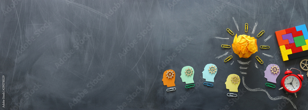 Education concept image. Creative idea and innovation. Crumpled paper as light bulb metaphor over blackboard - obrazy, fototapety, plakaty 