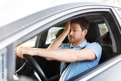 Fotomural transport, vehicle and driving concept - tired sleepy man or car driver rubbing