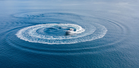 Wall Mural - Aerial view of speed motor boat on open sea