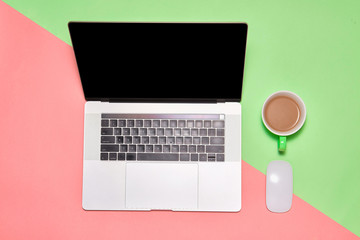 Sticker - Top view of workspace with laptop, cup of coffee and copy space on colored background