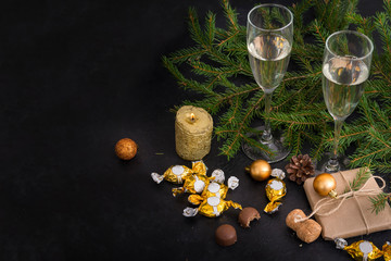 fir branches, 2 glasses of champagne, chocolates with Golden wrappers, balloons, gift box, sparkling wine, Christmas decor