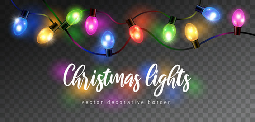 Wall Mural - Vector beautiful colorful shining christmas lights garland isolated on dark background - decorative border