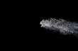 © piyaphong - White powder explosion isolated on black background
