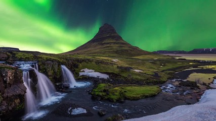 time lapse of northern lights (aurora borealis) at kirkjufell mountains and kirkjufellsfoss in icela