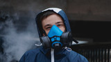 Fototapeta  - Protection respirator half mask for toxic gas.The man prepare to wear protection air pollution in the chemical industry. Smoke