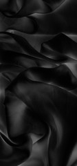 Luxury black soft silk flatlay background texture, holiday glamour abstract backdrop