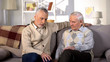 © motortion - Thoughtful senior males sitting nursing home sofa, life difficulties, problem