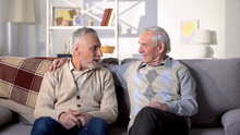 Two Old Friends Talking Having Fun Sitting On Sofa, Positive Mood, Conversation