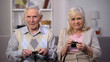 © motortion - Upset aged couple showing empty purses on camera, social reform, retirement
