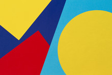 Texture Background Of Fashion Papers In Memphis Geometry Style. Yellow, Blue, Light Blue, Red Colors. Top View, Flat Lay