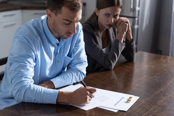 Wall Mural - couple with divorce documents at table at home