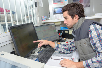 a factory software maintenance worker