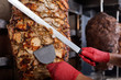 Fried meat on a skewer for cooking of donors or shawarma. Close-up