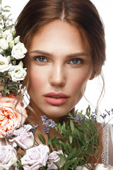 Wall Mural - beautiful woman with classic nude make up, light hairstyle and flowers. beauty face.