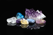 Pile Of Different Beautiful Gemstones On Black Background