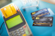 © Pongvit - Swipe multiple credit cards in the shop. shopping and retail concept.soft focus.