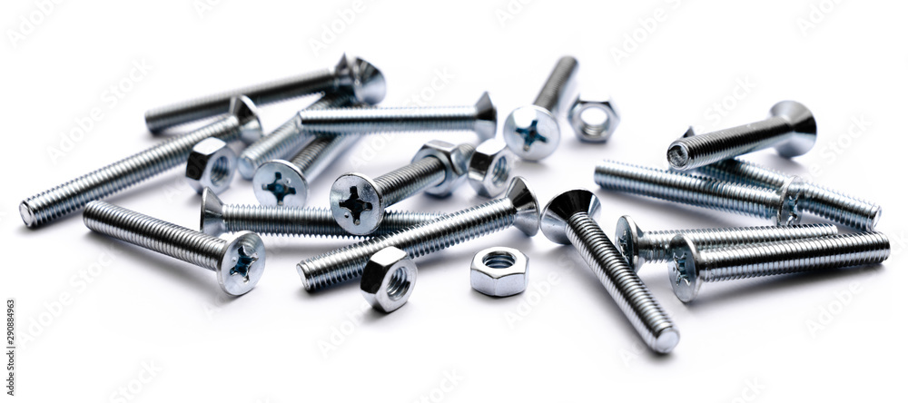 Top view of stainless steel bolts or iron nails on brigth white background with silver color. Metal screws for use in sheet metal.